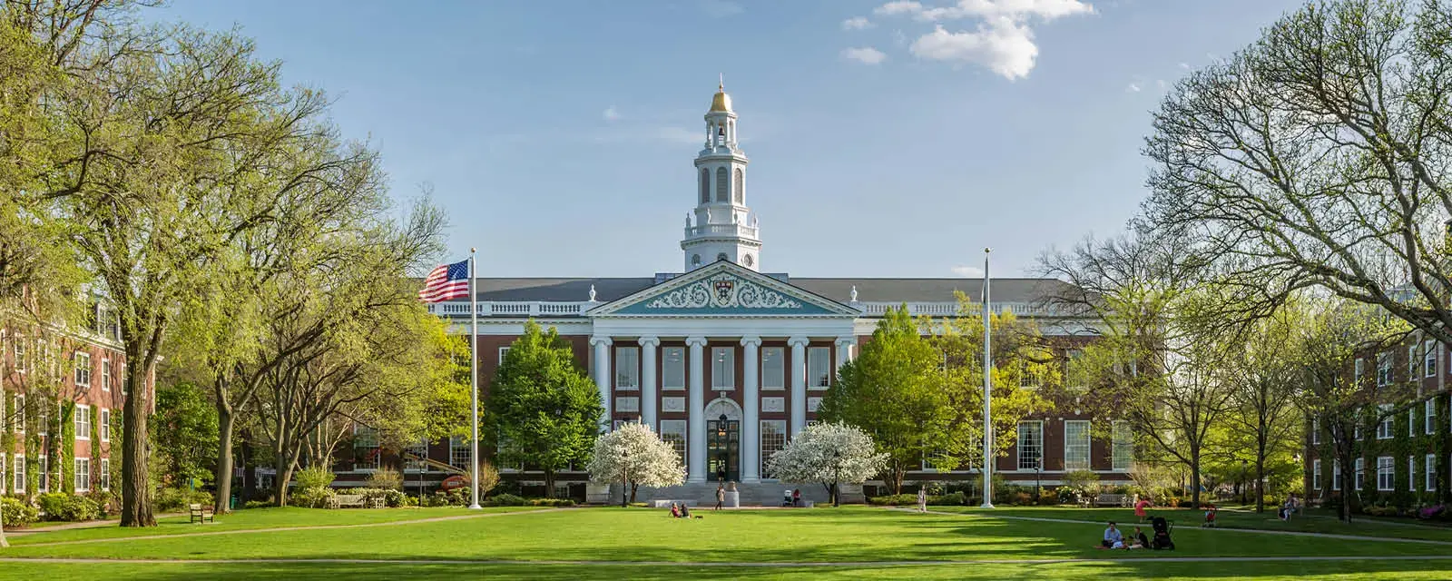 Cambridge, MA, USA September 10, 2017: The historic architecture of Cambridge in Massachusetts, USA showcasing the famous Harvard University Institution with lots of international students and locals passing by.