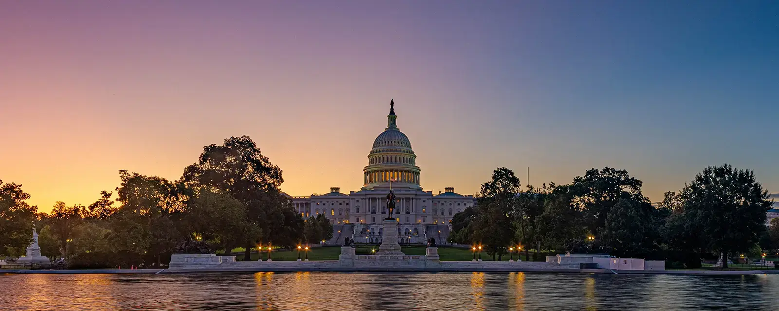 U.S. Capitol Building with colorful sky in the background