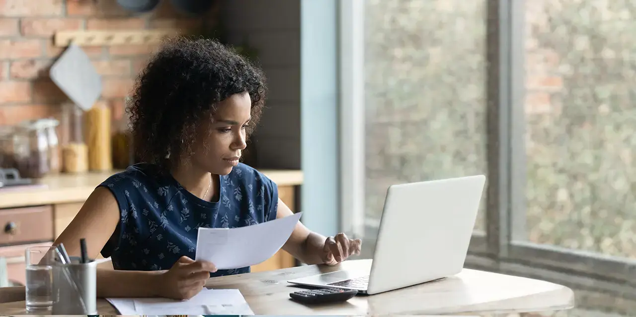 Serious woman law student calculating taxes.