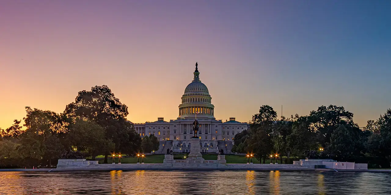 U.S. Capitol Building with colorful sky in the background