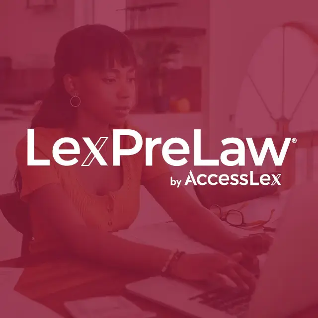 An African American female student sitting at a computer researching the LexPreLaw pathway program. 