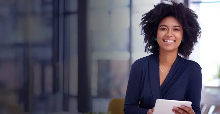 Portrait of a young businesswoman using a digital tablet in an office