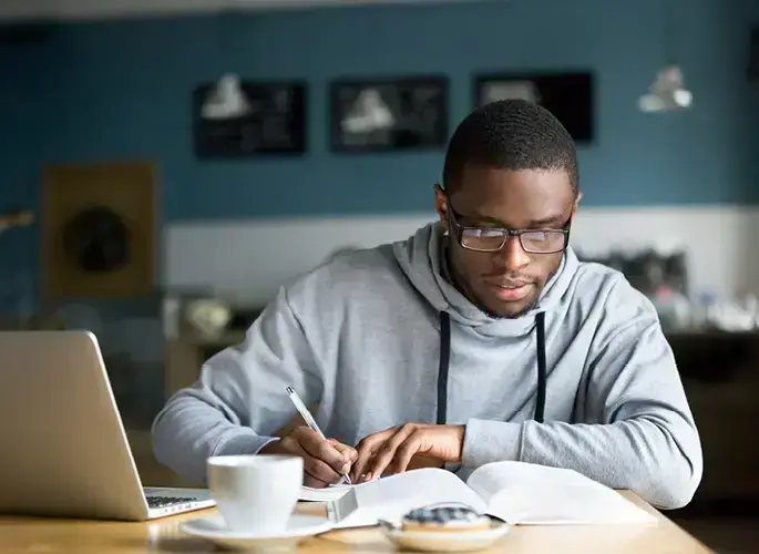 A student studying in a coffee shop