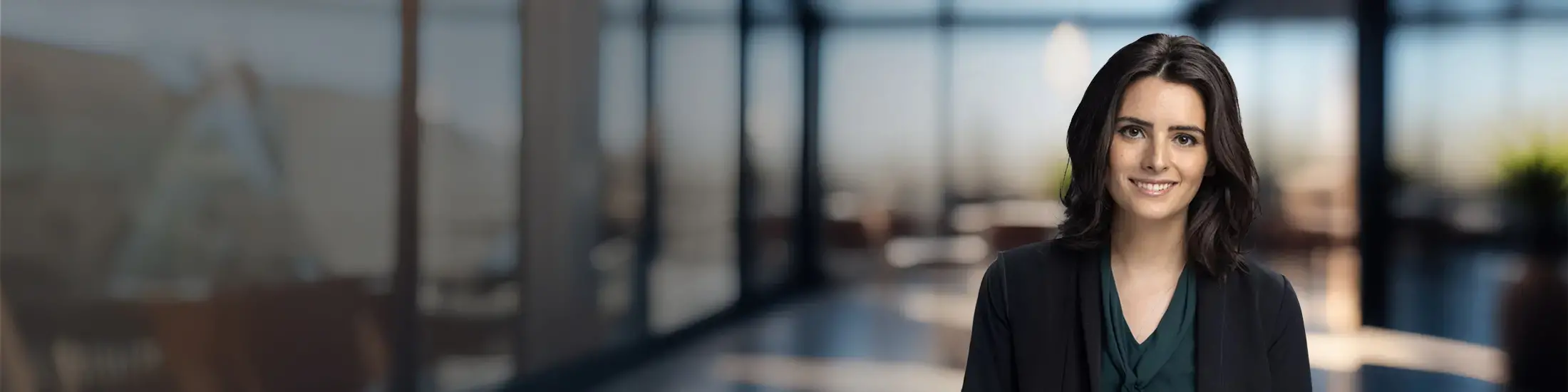 Image of a Helix Bar Review Champion with a dark suit in front of windows