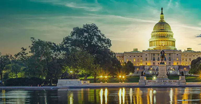 Image of the Capitol Building with reflection on water. 