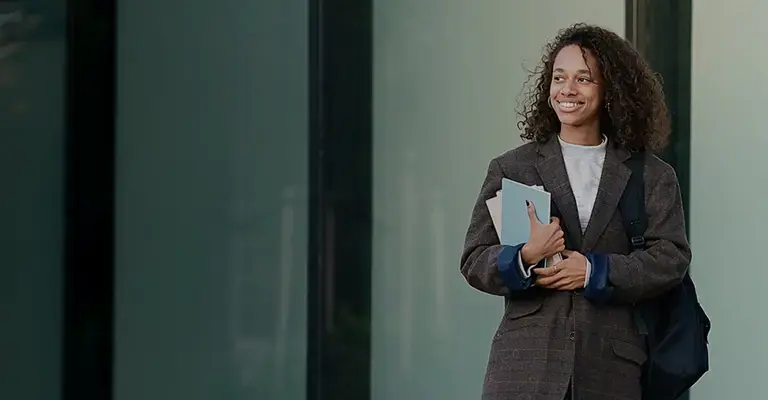 Young profession woman standing in front of building