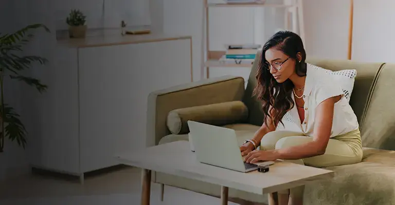 Young lawyer reading and typing on her computer.
